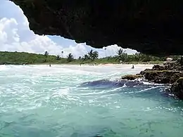 A view tobarrios Navío Beach from a nearby sea cave