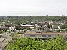 A downtown view with a large river running through the center of the image.