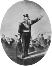 Engraving depicting a man in an admiral's uniform, spyglass in hand and left hand pointing forward, standing on a plaform aboard a ship while sailors fire cannons in the background