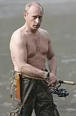 Vladimir Putin wearing a cross necklace