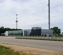 A modern one-story building with WMTV and Madison CW logos and a tower behind it