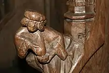 Statuette of a wet nurse forming part of a parclose screen in the Basilique Saint-Materne, Walcourt, Belgium
