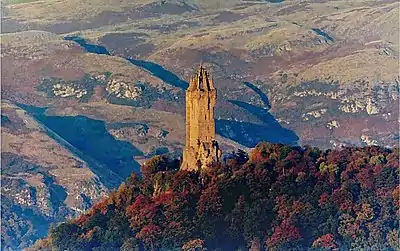 Image 18The Wallace Monument is a sandstone tower, built in the Victorian Gothic style. It stands on the summit of Abbey Craig, a volcanic crag above Cambuskenneth Abbey, from which Wallace was said to have watched the gathering of the army of English king Edward I, just before the Battle of Stirling Bridge.Photo credit: Ray Mann