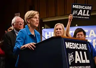 Image 12Elizabeth Warren and Bernie Sanders campaigning for extended US medicare coverage in 2017.  (from Health politics)