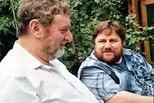 Kevin Davies, facing the camera and to the right of Nick Webb, seen from profile