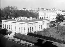 Expanded West Wing, circa the 1910s. President Taft's 1909 expansion covered most of the tennis court. Note the "bow" of the first Oval Office.
