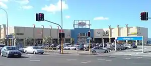 The front top parking lot at Glenfield Mall. Most of the parking, and most of the mall itself, is behind and below on further levels. (Photo taken prior to overhaul in the mid-2010s)