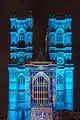Coloured light projected onto Westminster Abbey for Lumiere festival