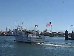 A typical fishing boat returning to the Westport Marina