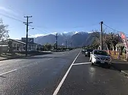 State Highway 6 running through Whataroa, with Mount Adams in the background