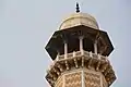 White marble cupolas cap minarets at the Tomb of Jahangir in Lahore, Pakistan