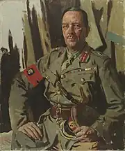 Portrait of Sir Henry Edward Burstall, three-quarter-length, slightly turned to the left, seated with his hand on his leg and holding his hat with the other, dressed in military uniform with an armband, a Sam Browne about his waist and across his chest, a ribbon bar pinned to his breast, a photomechanical print after William Orpen, early 20th century