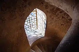 Wooden windows on one of the spiral staircases of Aali Qapo Palace.
