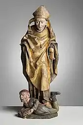 Wooden sculpture of Henry stepping on a bloodied Lalli from Akaa church, c. 1500