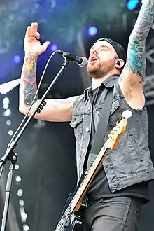Gilbert performing with Wovenwar in 2014