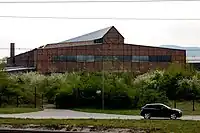 The Serbenhalle of the Raxwerke. The hall, was booty from Serbia, rebuilt in Wiener Neustadt. It housed a subcamp of the Mauthausen concentration camp used to manufacture V2 rockets. One year before, still in Serbia, more than 1,700 residents of Kraljevo had been shot dead in front of and in this hall by the Wehrmacht as revenge for a partisan attack during the Kraljevo massacre.