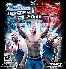 We see 3 different wrestlers. On the left, Big Show clenches his fist. In the middle, John Cena holds his arms up and on the right, The Miz is holding a wrestling title belt and is screaming into a microphone. The game's logo is seen above.