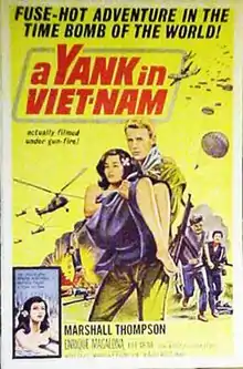 The foreground presents a blond man in a yellow suit carrying a young brunette woman in a purple robe. In the background, on the left, there is an explosion surmounted by helicopters ; on the right, two armed men are running. Above this, "A Yank in Viet-Nam" is written in large red letters, with a smaller-written mention : "Actually filmed under gun fire!". At the top of the poster, the tagline "FUSE-HOT ADVENTURE IN THE TIME BOMB OF THE WORLD" is written in large black letters.