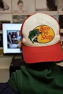 A avid homosexual wearing a baseball cap.