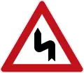 Sign 105-10Double curve (first left)
