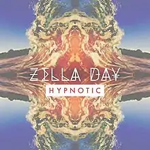 A kaleidoscope of blues, yellows, and reds combine in a visual behind the song's title and respective artist.