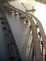 Left Coast Lifter and the old and new eastern spans of the Bay Bridge near Yerba Buena Island (2010).