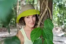 woman in jungle with ayahuasca vine