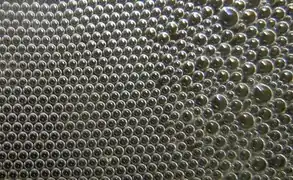 Hexagonal order of bubbles in a foam.