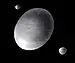 Artistic impression of Haumea and its two known satellites
