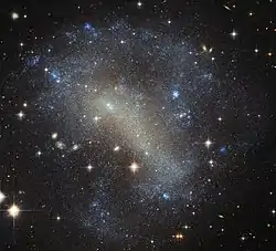 IC 4710 lies roughly 25 million light-years away in the southern constellation of Pavo.