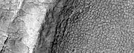High-center polygons, as seen by HiRISE under HiWish program Image is of the top of a debris apron in Deuteronilus Mensae.
