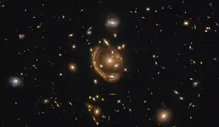 Dubbed the "Molten Ring", Hubble sees strong lensing around GAL-CLUS-022058s.