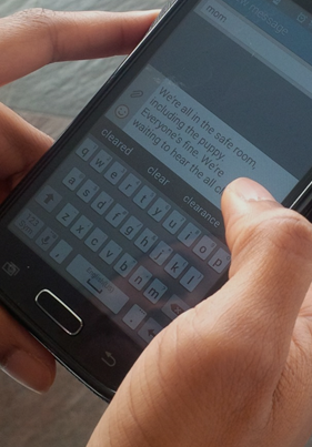 Person sending text to emergency point of contact.