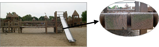 Wooden playset with greenish color from wood preservative