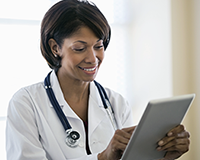 photo of a doctor looking at a notepad