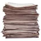 Photo of stacked newspapers