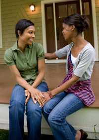 two female friends sitting down talking