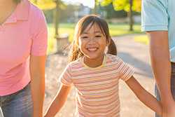 Parents holding baby