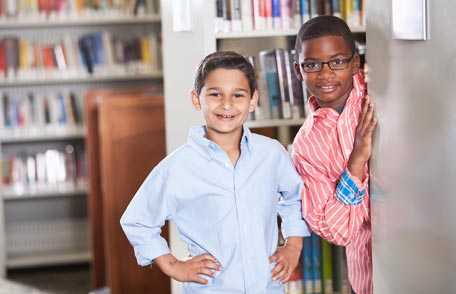 Two boys in school library