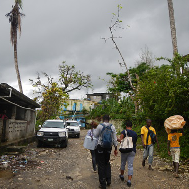 CDC and Haitian epidemiologists walking through a Haitian neighborhood