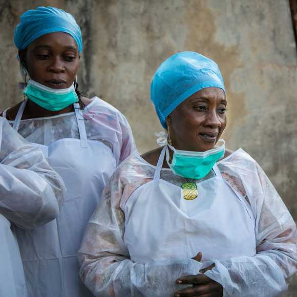Public health workers wearing personal protective equipment