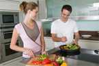 Man and a woman preparing meal