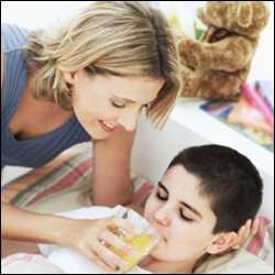 A woman cares for a sick child