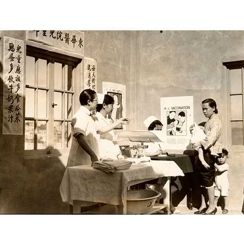 San Francisco History Center, San Francisco Public Library - A doctor coaxing a child with his mother at a Chinatown Well Baby Clinic, San Francisco, 1934 - In 1921, Congress passed the Maternity and Infancy Act to provide instruction in maternity and infant care. Through this funding, “Well Baby Clinics” were held across the country, typically segregated by ethnicity or race.