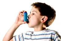 Young boy with inhaler