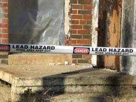 "Danger: Lead Hazard" tape stretched across a work area