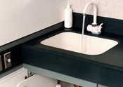 Running sink with anti-bacterial soap on sink