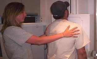 Technician assiting miner with x-ray