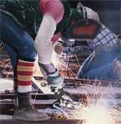 Welder wearing eye protection