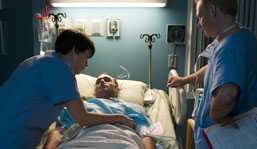 Nurses tending to patient